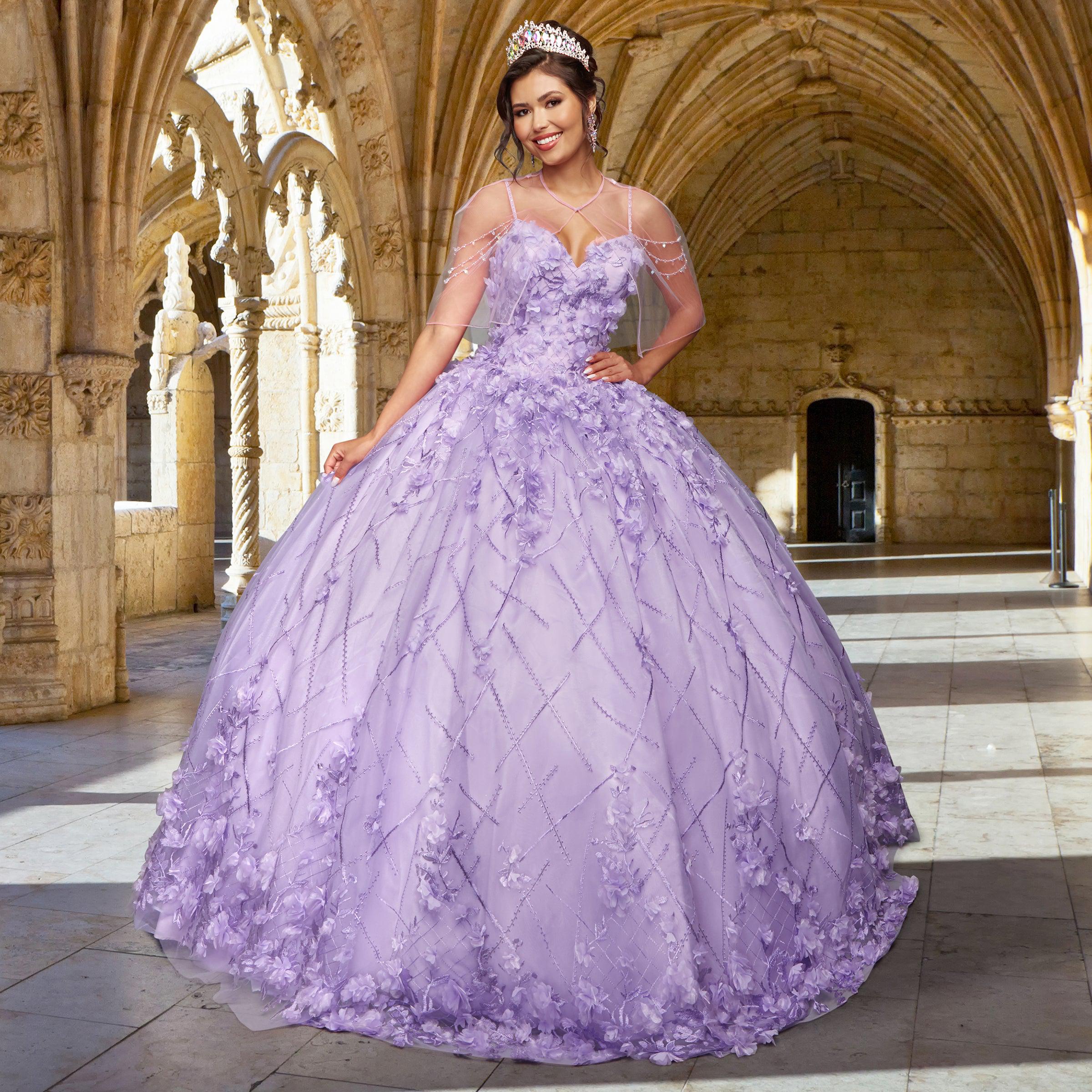A woman in the Quinceañera Sample Dress QF105 and a tiara stands in a sunlit, ornate stone hall with arched ceilings.